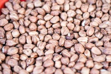 Shelled hazelnuts creating a natural healthy food background