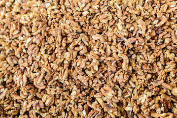Shelled walnuts forming natural healthy food background texture