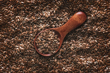 Wooden spoon with flax seeds.