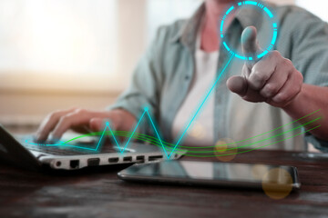 Digital interaction in a modern workspace with graphs and data analysis taking center stage