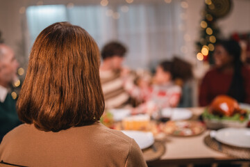 joyful family sharing a warm festive Christmas dinner creating happy memories together with laughter delicious food, spirit of love celebration togetherness around the holiday table