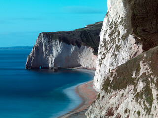 Extremely long exposure shot of Swyre head and butter rock on the Jurassic coast.  Dorset.