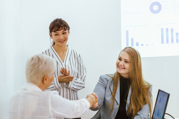 Business team showing unity success with hands together in office, teamwork collaboration and power motivation, diverse colleagues celebrating achievement corporate goal partnership