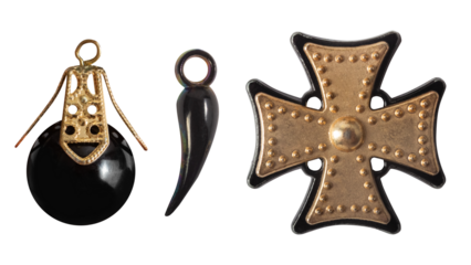 Isolated photo of various gothic, punk style black and golden pendants on white background.