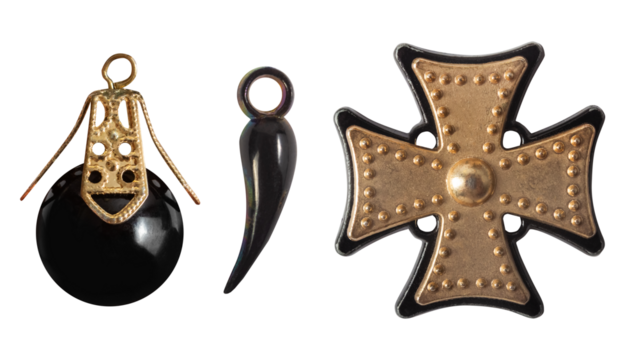 Isolated photo of various gothic, punk style black and golden pendants on white background.