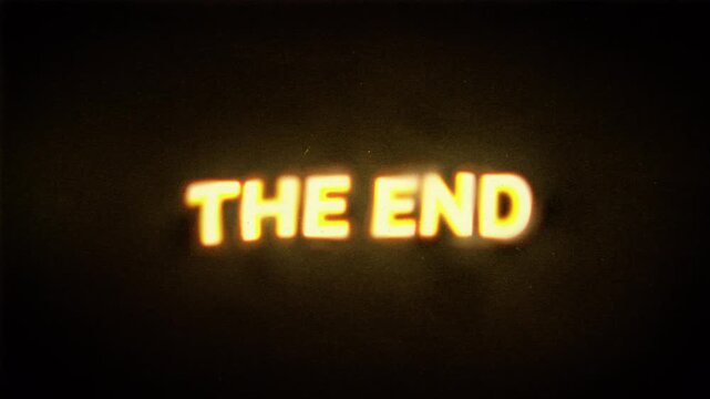 The End text from an old movie. Vintage analog film projection aesthetics