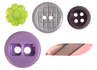 Isolated photo of various shaped and colored plastic decorative cloth buttons on white background.