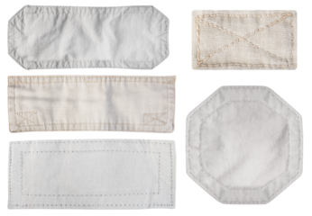 Isolated photo of brown and gray colored denim patches with stitch bordering on white background.