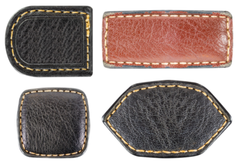 Isolated photo of various colored leather patches with stitched borders on white background.