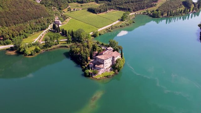 Beautiful Toblino lake is considered one of the most romantic lakes in the Trentino, Italy. aerial drone 4k hd footage of medieval castle Toblino from above. Sarca Valley 