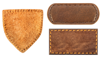 Isolated photo of brown suede and leather patches on white background.