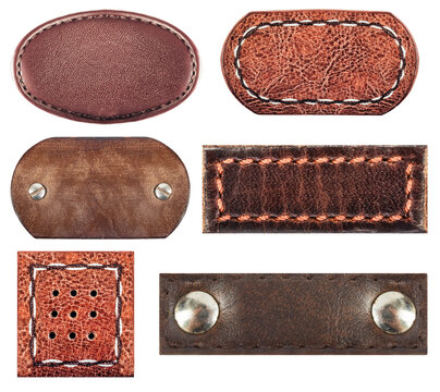 Isolated photo of various brown leather patches with stitch borders and rivets or studs on white background.