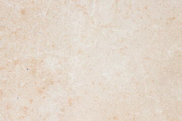 Grunge beige paper texture with subtle scratches and vintage surface imperfections. Natural background for retro design, antique mockups, craft projects and print overlays