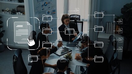 A diverse business team collaborates in a modern office setting, engaged in discussions about document management and teamwork, enhanced by digital overlay visuals. Raster