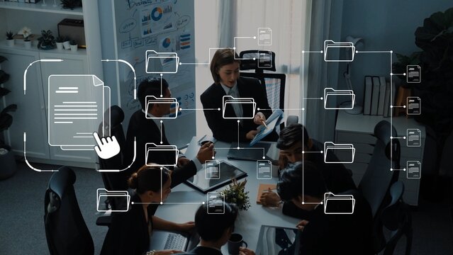 A diverse business team collaborates in a modern office setting, engaged in discussions about document management and teamwork, enhanced by digital overlay visuals. Raster