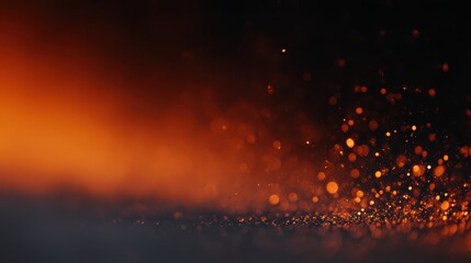 Bright orange embers flying in darkness, dramatic spark frame from top and bottom edges