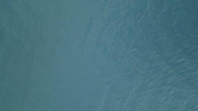 still blue turquoise water seen from above drone view lake atitlan guatemala beautiful nature travel destination central america volcanic caldera fooded pond unmoving peaceful serene relaxing relax