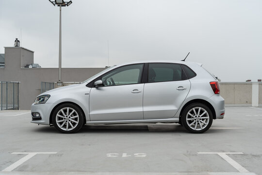 Wroclaw, Poland - May 10, 2025: Side profile view of a silver Volkswagen Polo parked on a rooftop, showcasing the car&rsquo;s clean lines and compact five-door design.