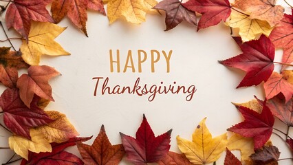 Happy thanksgiving text surrounded by a vibrant wreath of colorful autumn fall leaves on a white background