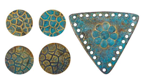 Isolated photo of rusty and worn, vintage copper metal decorative ethnic style pendants, inlays or elements on white background.