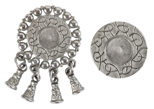 Isolated photo of vintage steel baroque metal decorative ethnic style pendants, brooch, buttons or elements on white background.