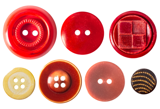 Isolated photo of various red colored plastic cloth decorative cloth buttons or rivets on white background.