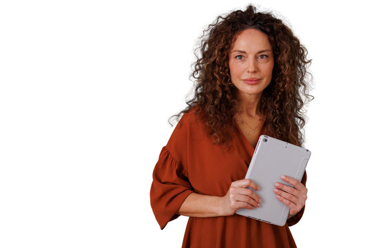 Elegant mature woman with curly hair holding a generic tablet device, looking at the camera, promoting career and digital lifestyle