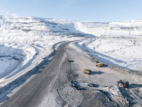 Aerial view of open pit coal mine in winter landscape - Powered by Adobe