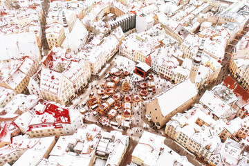 Aerial View of Tallinn with the Town Hall Square in winter, roofs with snow, Christmas mood