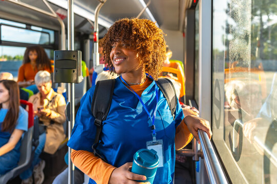 Young black nurse student commuting by bus to hospital - Powered by Adobe