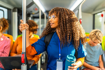 Young nurse commuting by bus to work