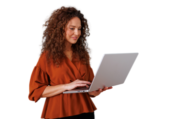 Businesswoman with curly hair smiling, working on laptop, typing and checking online information, transparent background