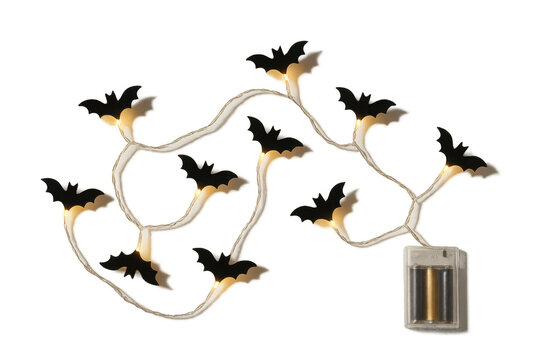 Halloween bat string lights illuminating spooky festive decoration with warm glow and battery pack, transparent background