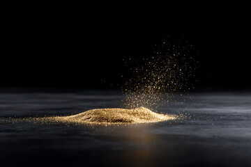 event decor, reflective black table adorned with confetti and glitter, bathed in warm golden light, creating a cinematic high contrast