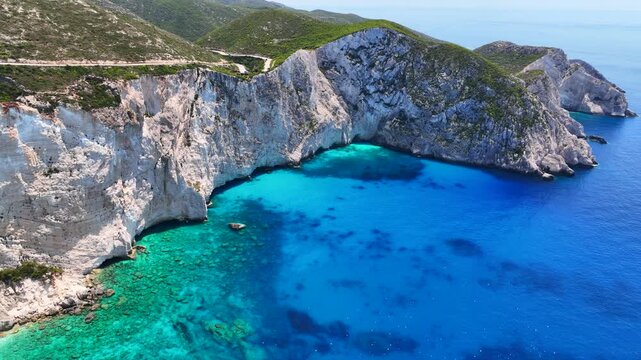 Aerial drone video of paradise scenic turquoise beaches and white rock formations near small port of Porto Vromi an ideal place to start a boat tour near amazing North Zakinthos island, Ionian, Greece