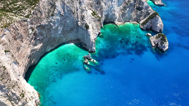Aerial drone video of scenic turquoise beaches and white rock formations near small port of Porto Vromi an ideal place to start a boat tour near amazing North Zakinthos island, Ionian, Greece