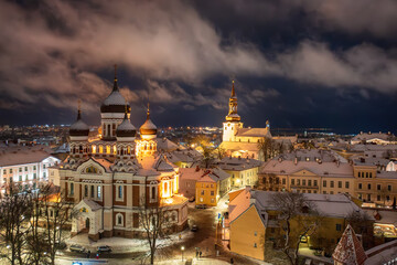 Aerial night View of Tallinn in winter with Alexander Nevsky Cathedral, roofs with snow, Christmas mood