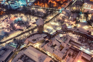 Aerial night View of Tallinn in winter, roofs are covered with snow, Christmas mood