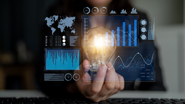 A business professional presents a light bulb symbolizing innovation amidst a digital interface filled with data graphs, maps, and analytics, embodying creative solutions. Scalp - Powered by Adobe