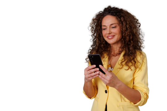 Woman with curly hair smiling and using a smartphone, connecting and interacting with social media apps