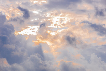 sun rays through cumulus clouds