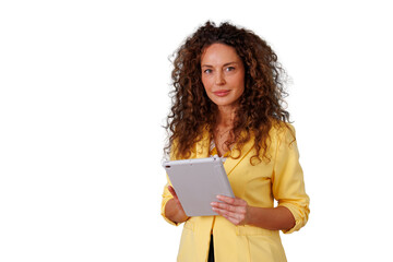 Obraz premium Confident businesswoman wearing a yellow jacket, holding a tablet, looking at the camera with a transparent background