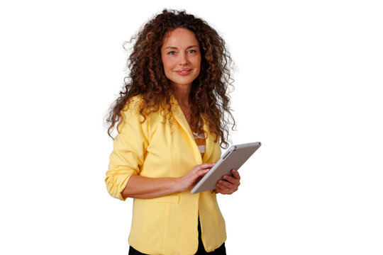 Professional businesswoman with curly hair holding digital tablet, smiling and looking at camera for technology or business concept