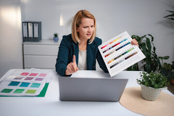 Woman arguing color choices during remote video call