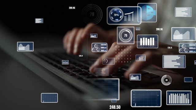 Close-up of hands typing on a keyboard with digital data visualizations and graphs in the background, representing modern technology and analytical processes. Xenic