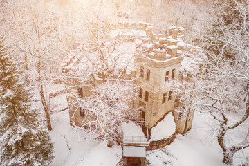 Old castle in the winter Glen park. Tallinn, Estonia.