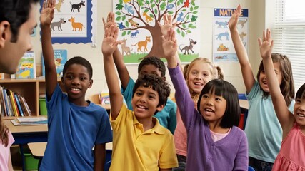 male teacher engaging diverse elementary students in bright classroom with colorful posters, math chart, storybooks, eager children raising hands during interactive lesson; smiling faces, teamwork, - Powered by Adobe
