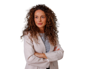 Businesswoman with curly hair posing, crossing arms, showing confidence and professionalism on transparent background