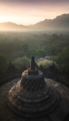 Spiritual sunset view of Borobudur&rsquo;s ancient terraces a serene landscape bathed in warm golden light