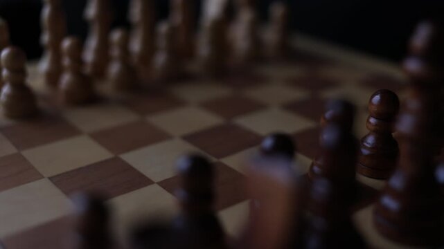 Rotating chessboard with strategically placed pieces in motion, depicting the eternal struggle between black and white factions in cerebral gameplay.